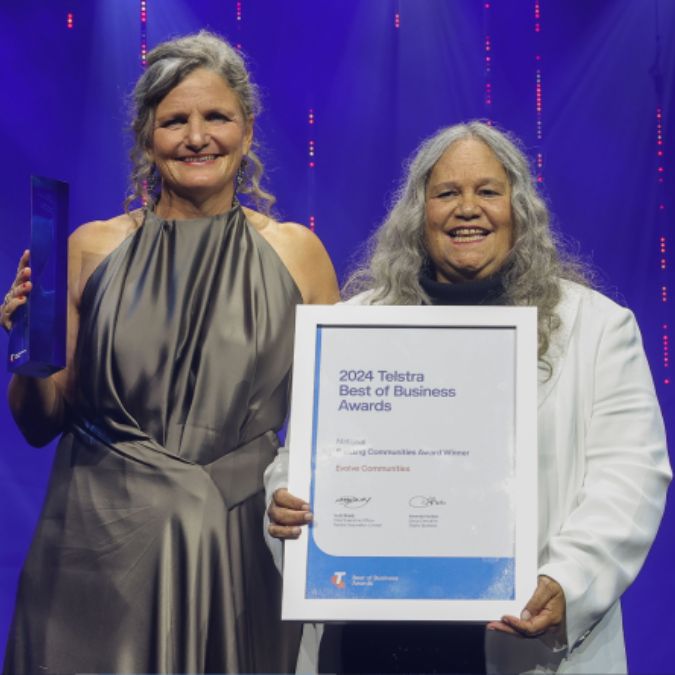 Carla Rogers and Aunty Munya Andrews holding up their National 2024 Telstra Best of Business Award for Building Communities